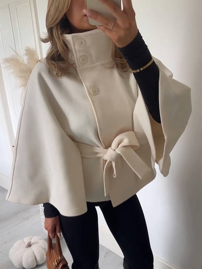 Manteau femme boutonnage ceinture col montant manches cape